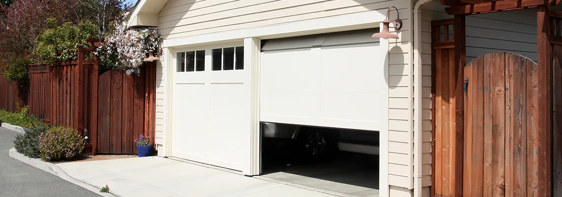 Fix Metal Garage Door Jerking in Oshawa, Ontario